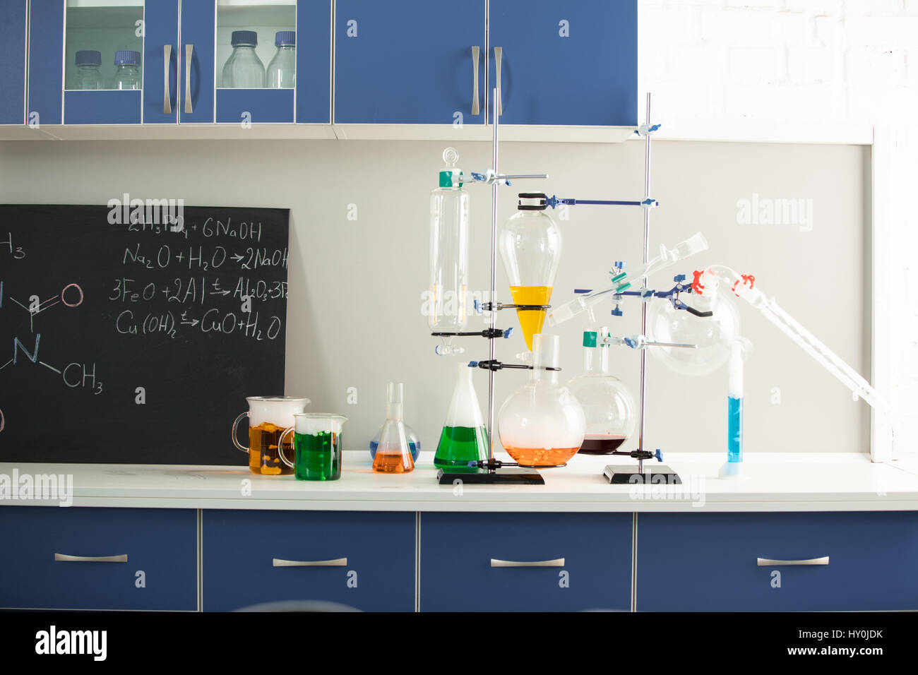 Science laboratory interior with colorful reagents and blackboard Stock Photo - Alamy