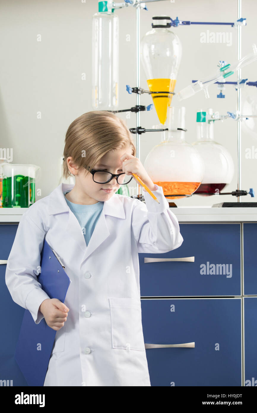 Little boy wearing lab coat in science laboratory Stock Photo Alamy