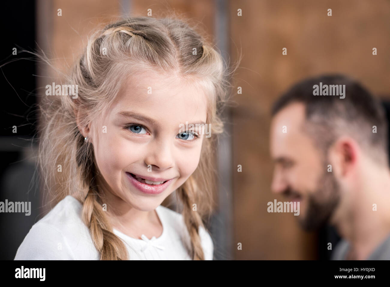 Portrait of cute little girl smiling at camera Stock Photo - Alamy