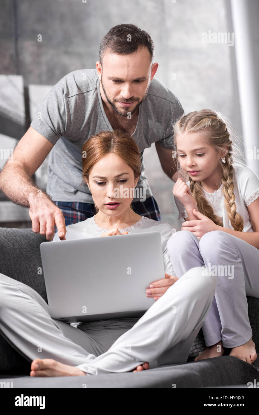 Mother father young daughter pensive hi-res stock photography and ...