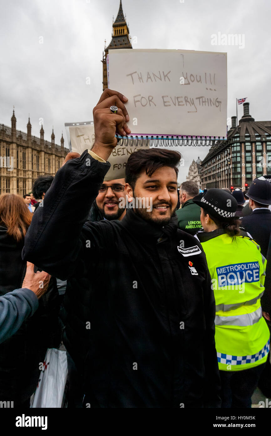 Young British Muslims Hold Up Signs Supporting The Police After The London Terror Attack One Week Earlier, Westminster Bridge, London, UK Stock Photo