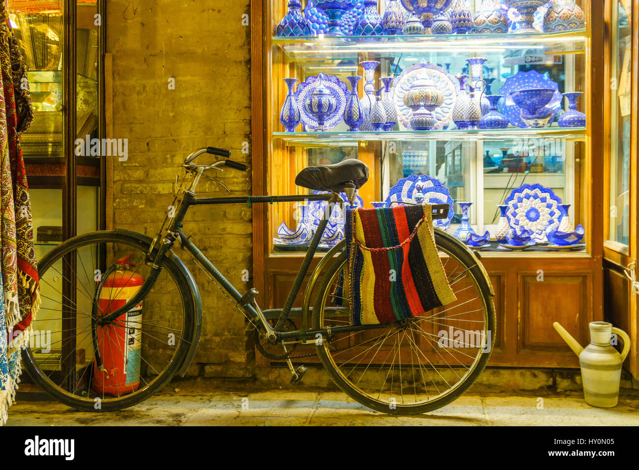 handicraft at bazaar of isfahan with bike an pottery Stock Photo