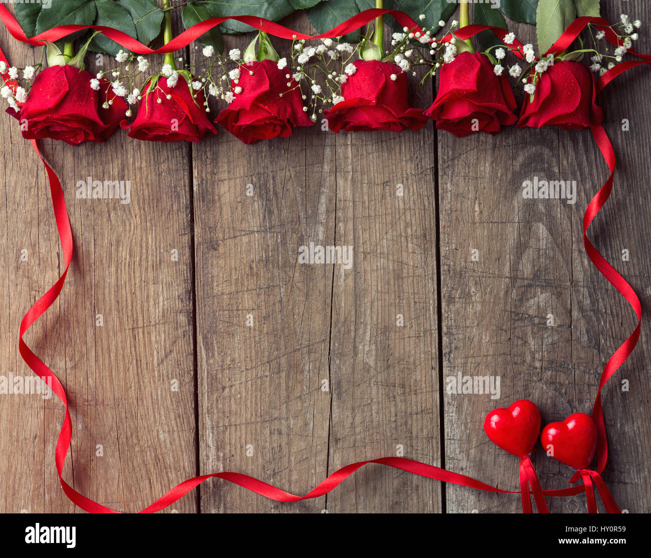 Red roses with ribbon frame background, copy space Stock Photo - Alamy
