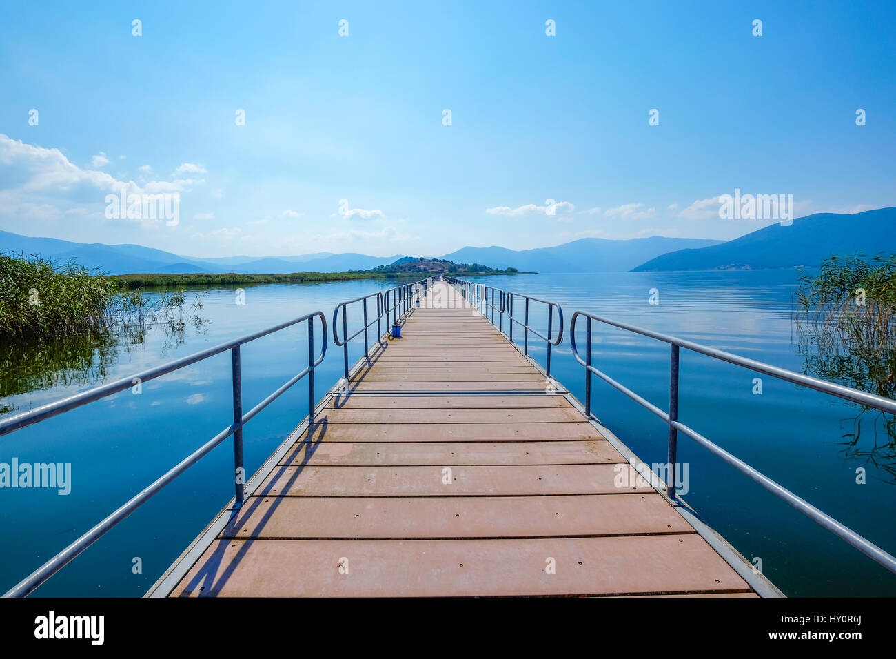 The pedestrian ponton bridge used to connect the Agios Achillios island in the Small Prespa Lake in Macedonia Greece Europe. Stock Photo