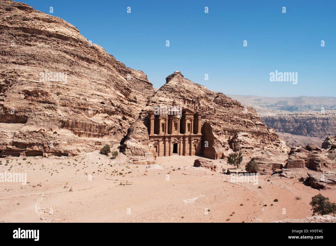 Jordan: the Jordanian landscape with view of the Monastery, the monumental building carved out of rock in the archaeological Nabataean city of Petra Stock Photo