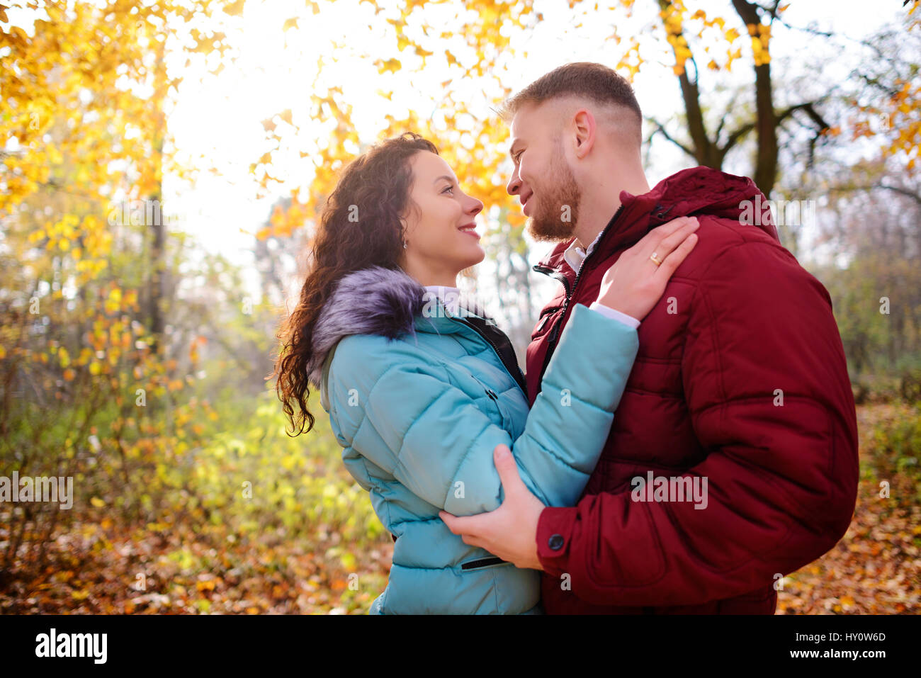 Portrait of young loving couple kissing in autumn park Stock Photo - Alamy