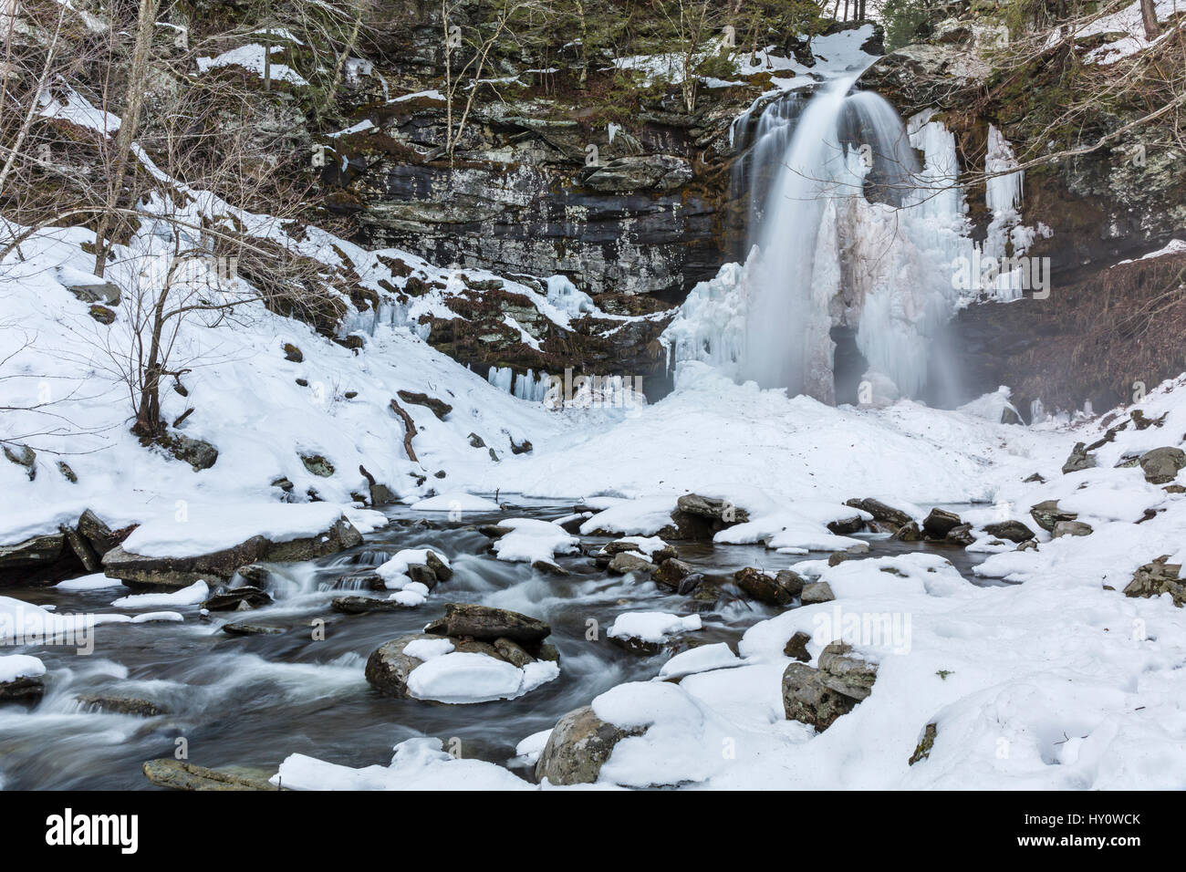 Plattekill Falls and creek slowly thawing out after a big March snowstorm in Platte Clove in the Catskills Mountains of New York Stock Photo