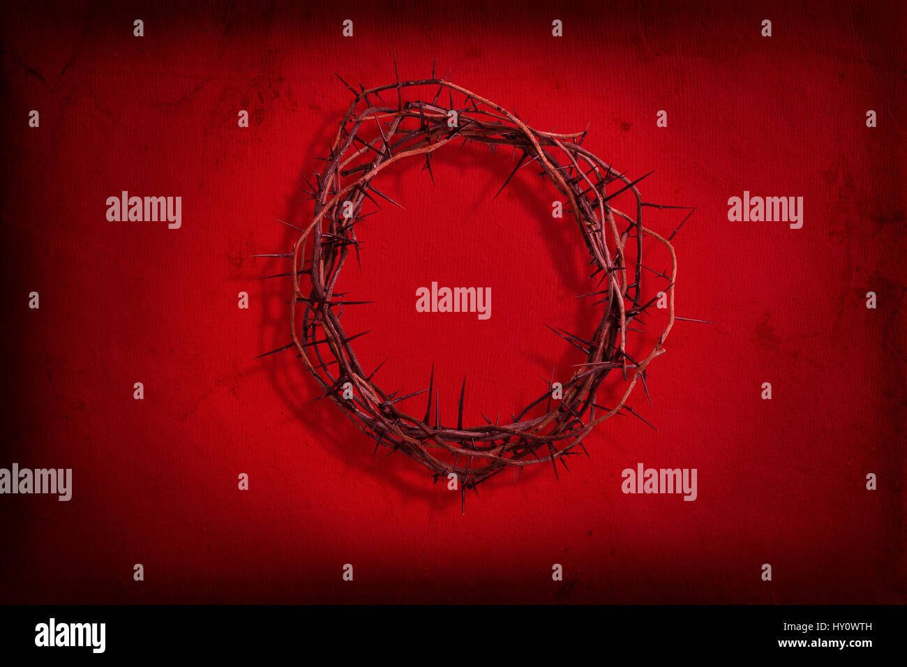 A crown of thorns on red grunge paper background Stock Photo - Alamy
