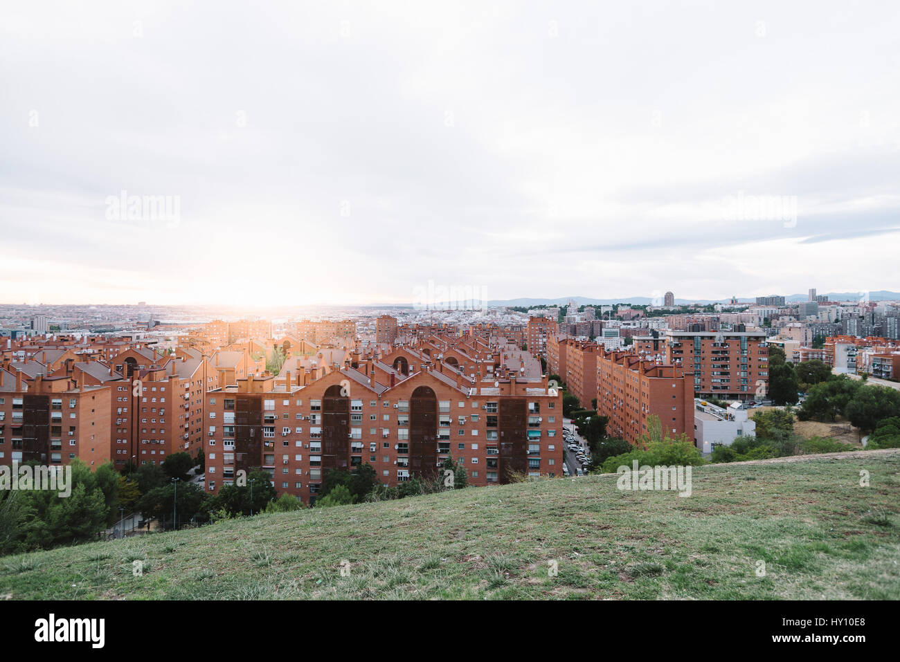 Madrid cityscape at dusk from a residential district and mountain range at background Stock Photo