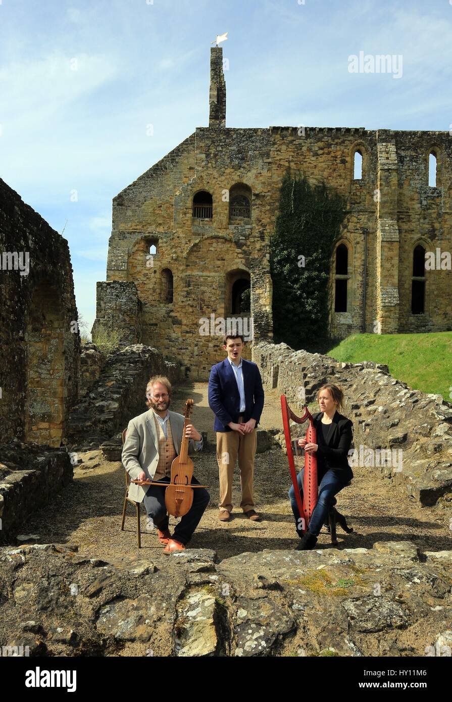 Musicians from Schola Gregoriana of Cambridge perform a recently rediscovered 500-year-old Easter carol at Battle Abbey in East Sussex. Stock Photo