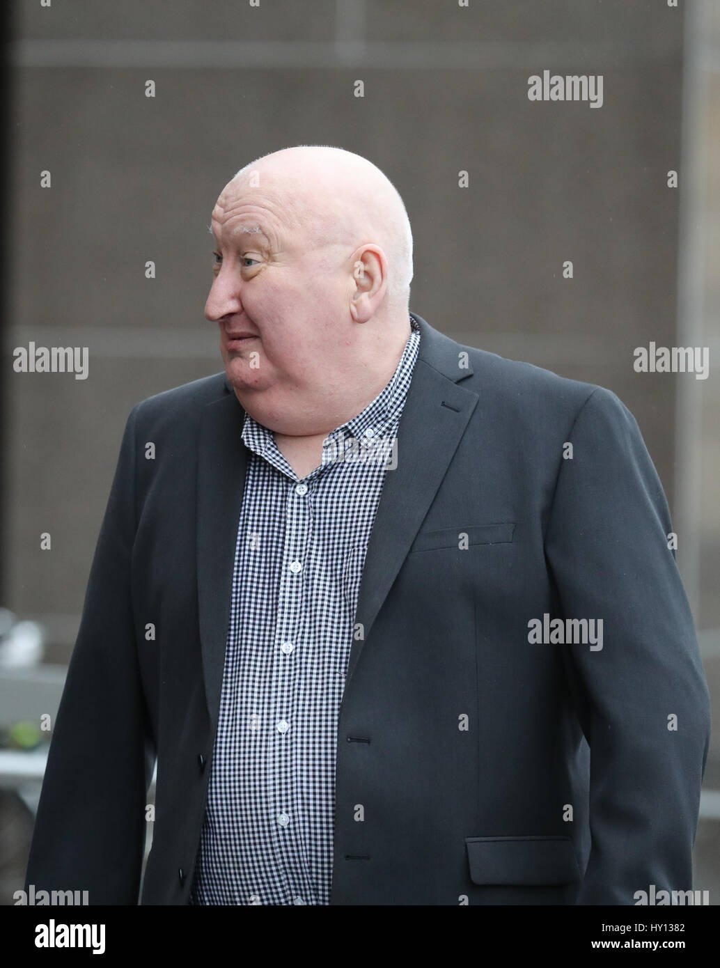 Harry Clarke (left), the driver of a bin lorry which crashed killing six people in 2014, arriving , with an unidentified man, at Glasgow Sheriff Court where he will be sentenced for culpable and reckless driving on a separate occasion nine months after the tragedy. Stock Photo