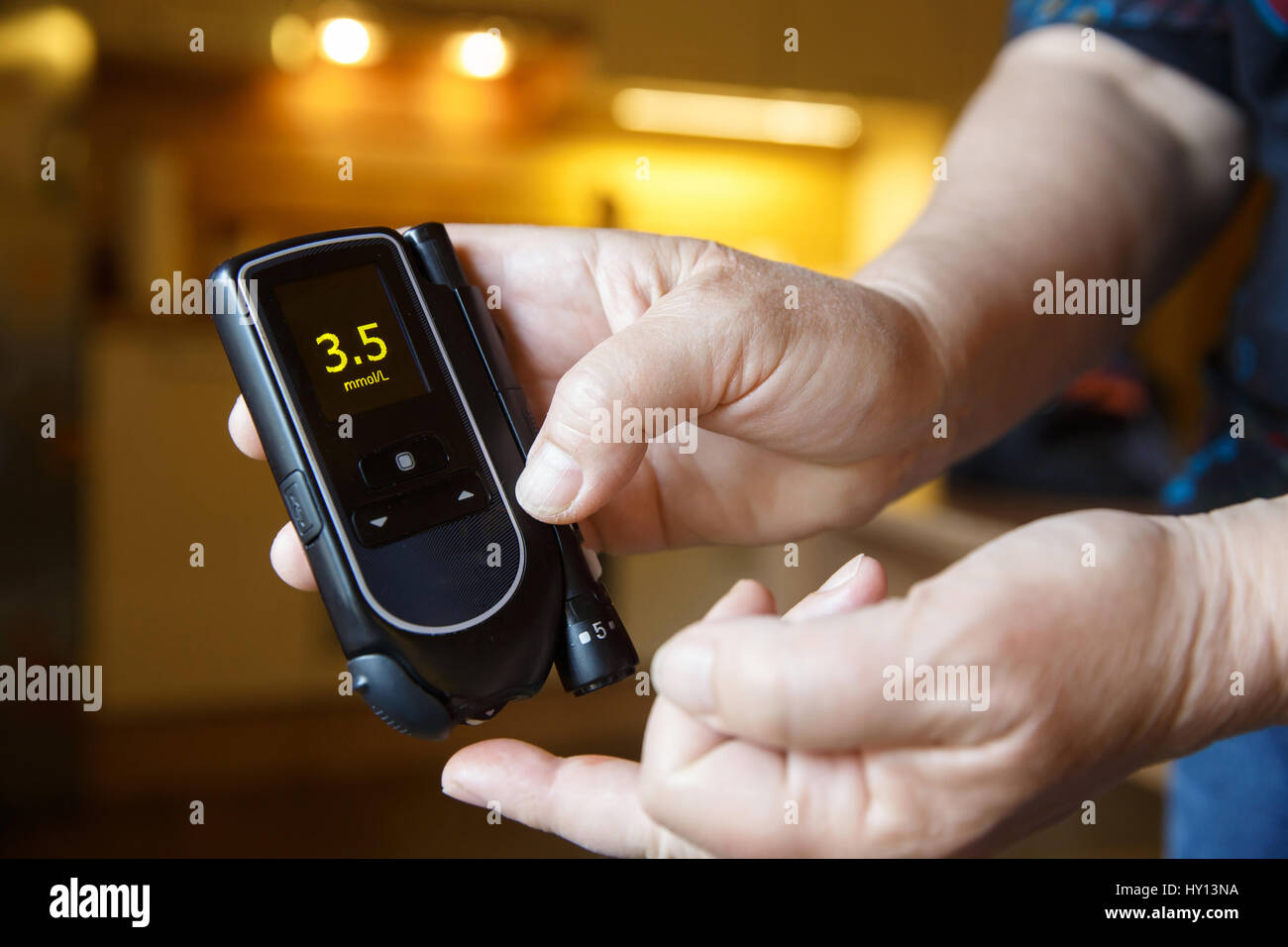 Hypoglycemic diabetic patient testing her blood for sugar level at home