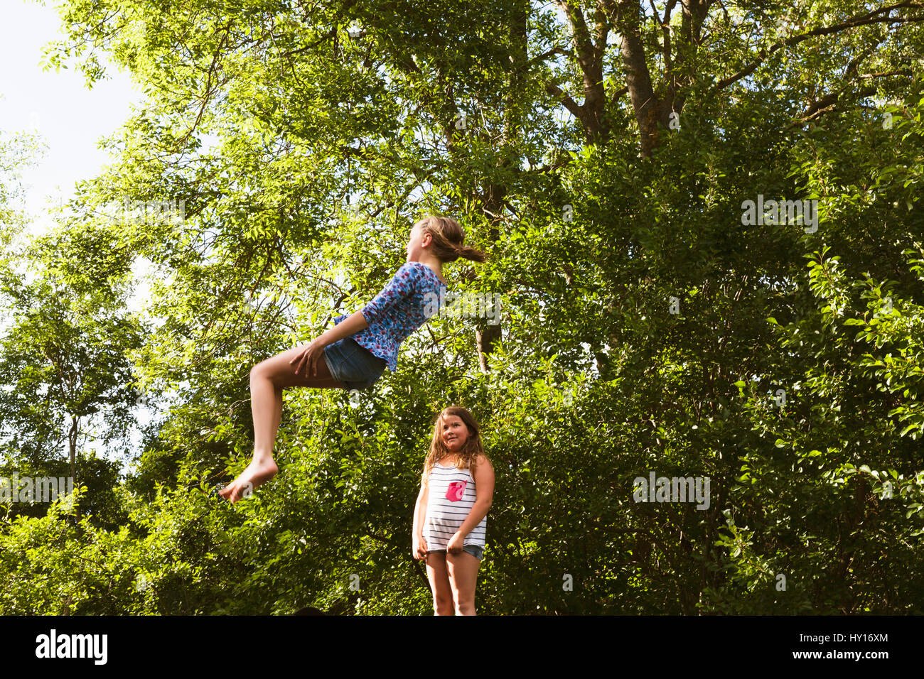 Two Girls Jumping High Resolution Stock Photography and Images - Alamy