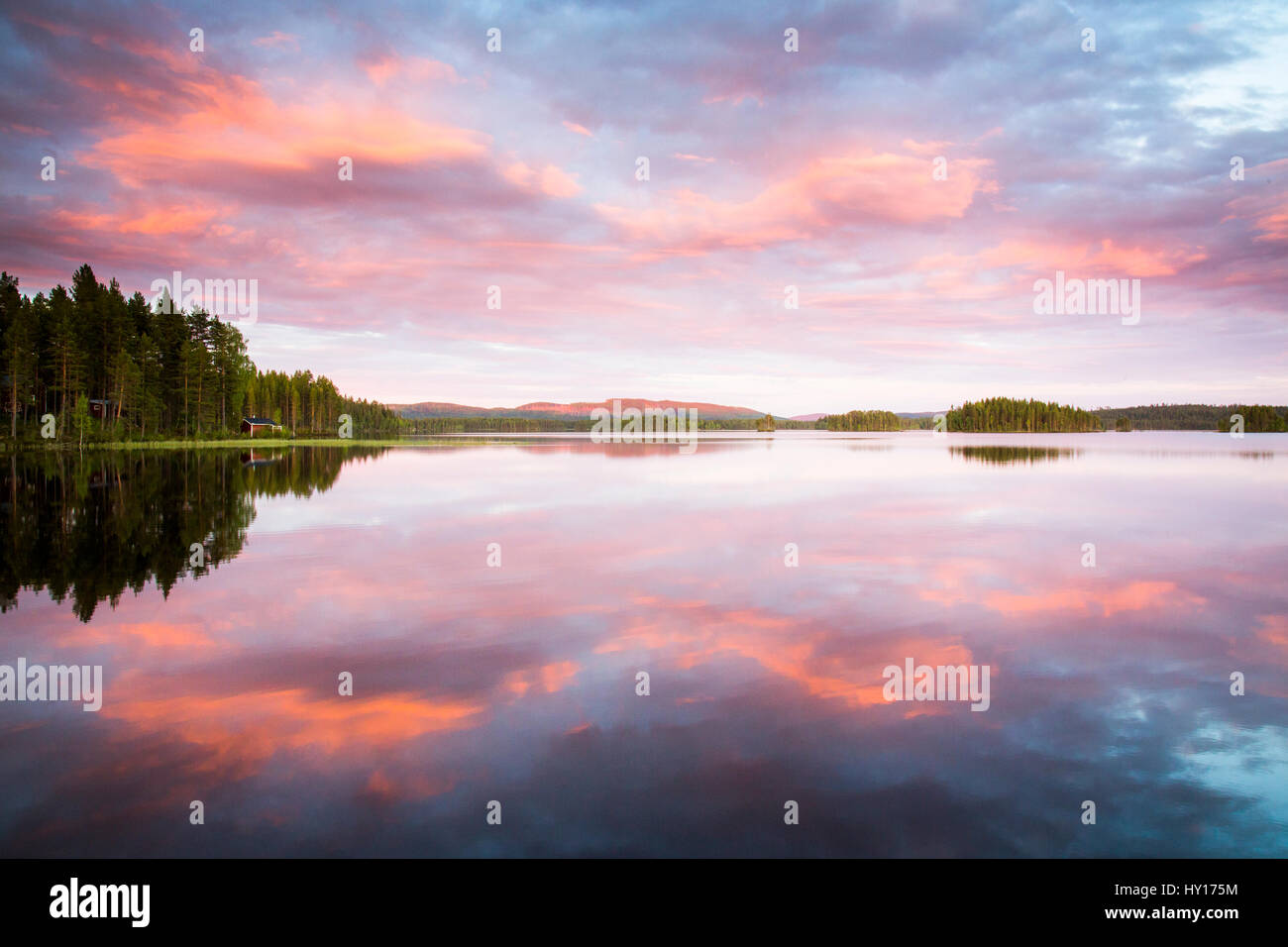 Sweden, Medelpad, Storskalssjon, Scenic view of lake at sunset Stock Photo