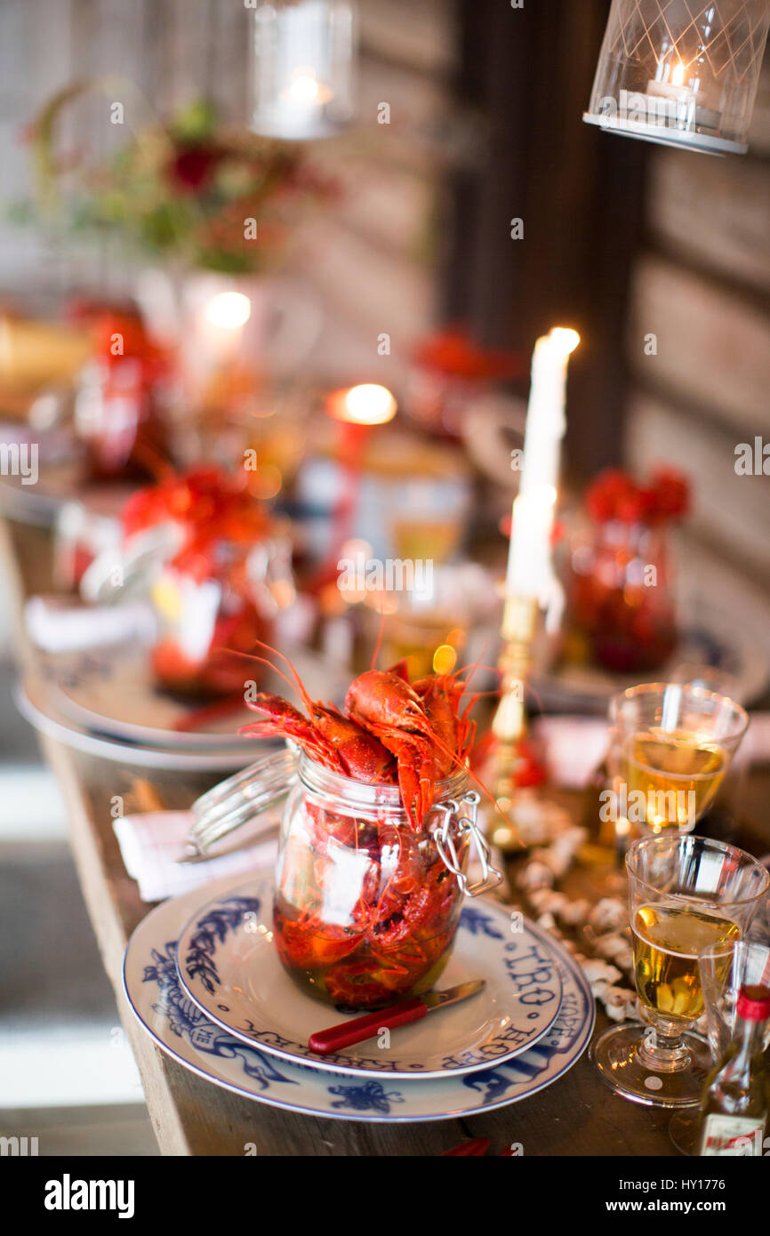 Sweden, Crayfish on wooden table at crayfish party Stock Photo
