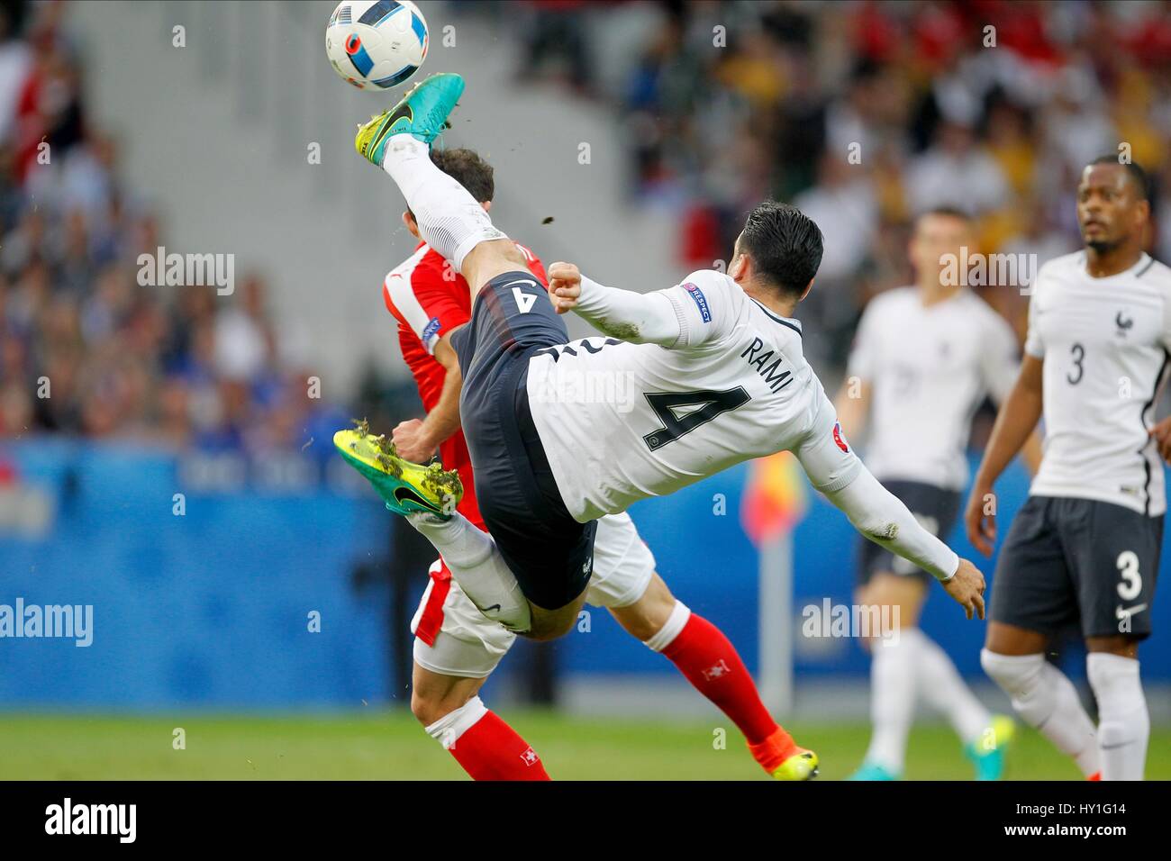 ADIL RAMI GOES IN HIGH ON ADMI SWITZERLAND V FRANCE STADE PIERRE-MAUROY LILLE FRANCE 19 June 2016 Stock Photo