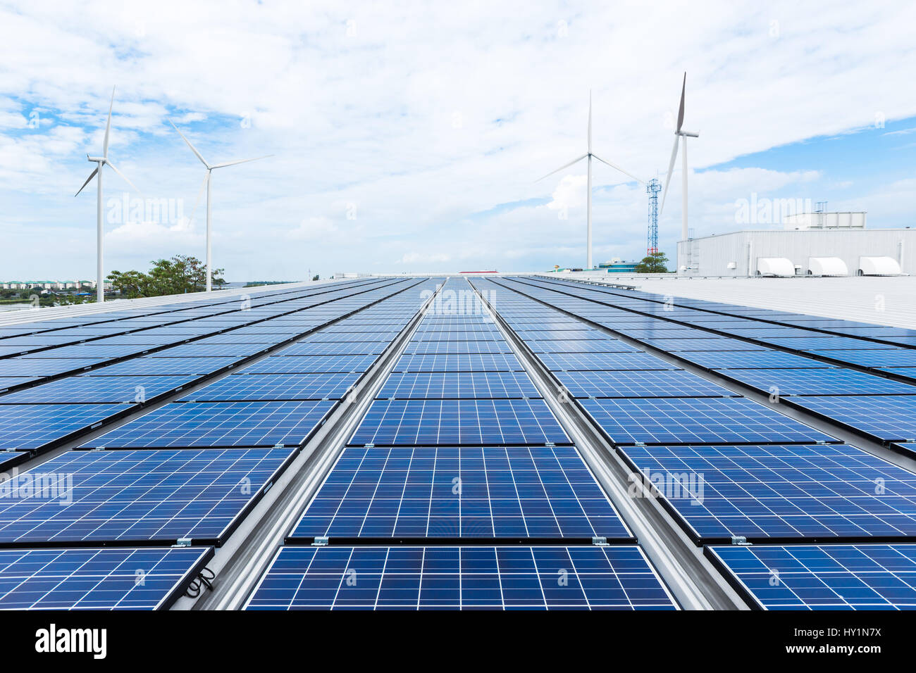 Solar panels on factory roof Stock Photo - Alamy