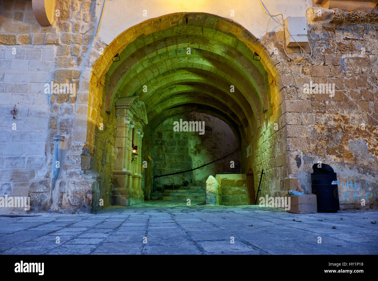 The pass through the fortress wall inside Senglea fortified city (or Civitas Invicta) in the early morning. Malta Stock Photo