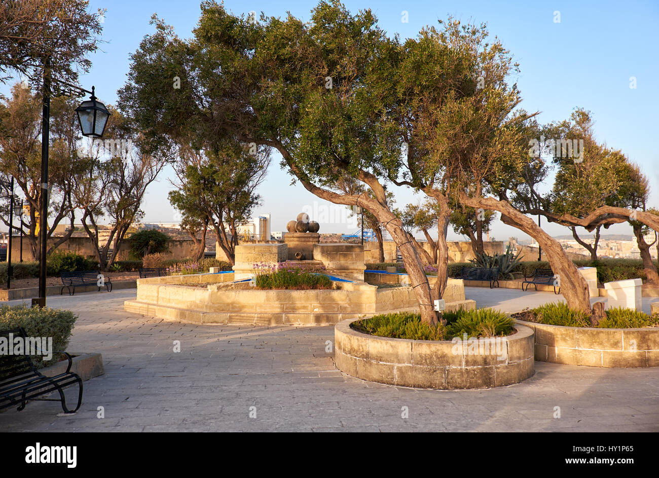 The early morning view of Gardjola Gardens with fountain in the center in the shape of the Maltese cross, Senglea, Malta Stock Photo