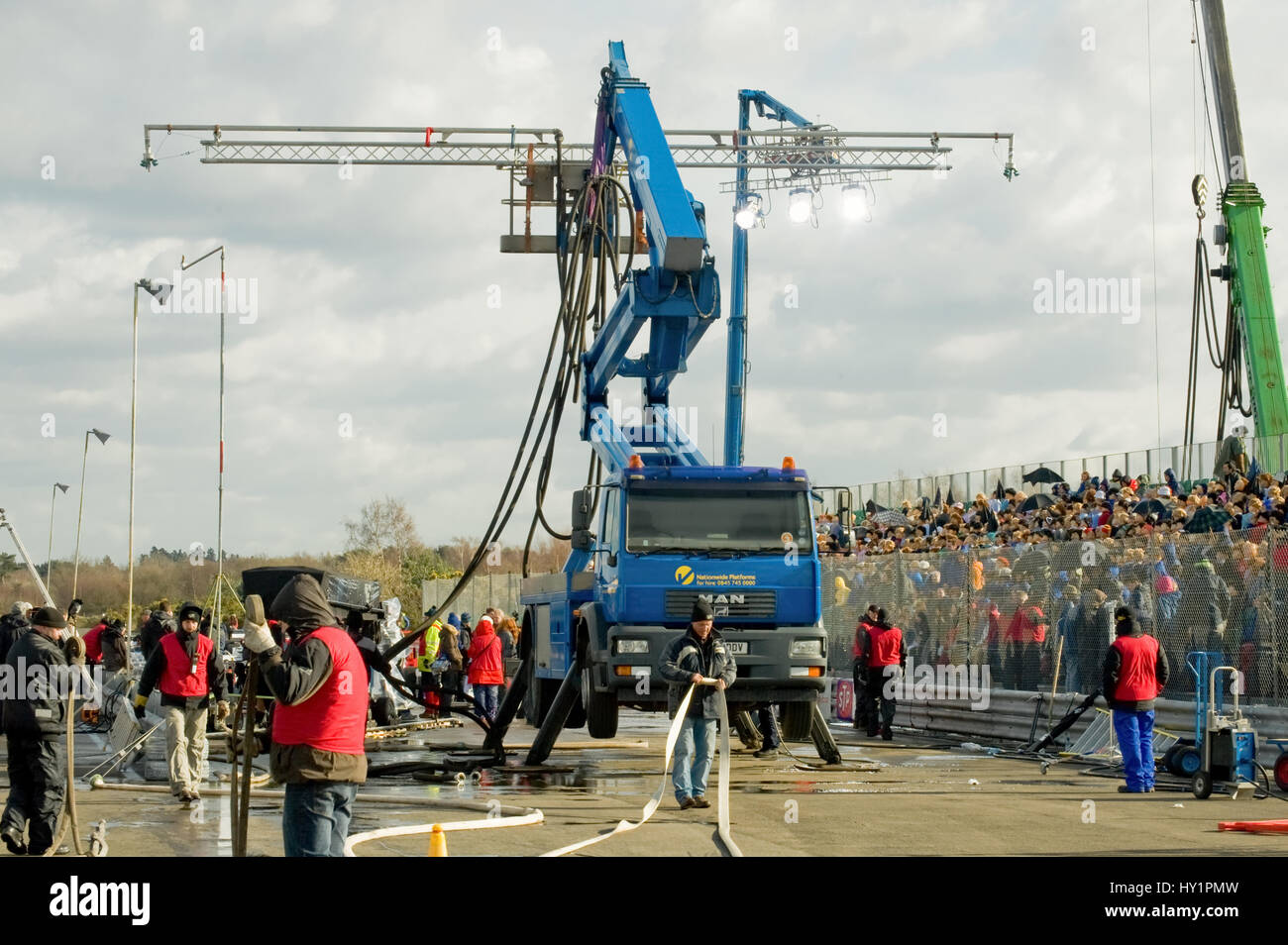 Blackbushe, UK March 5, 2012 Rain machine and tech crew on the film