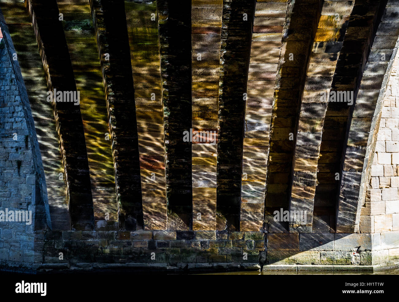 Water reflection on the ribbed Framwellgate Bridge Stock Photo