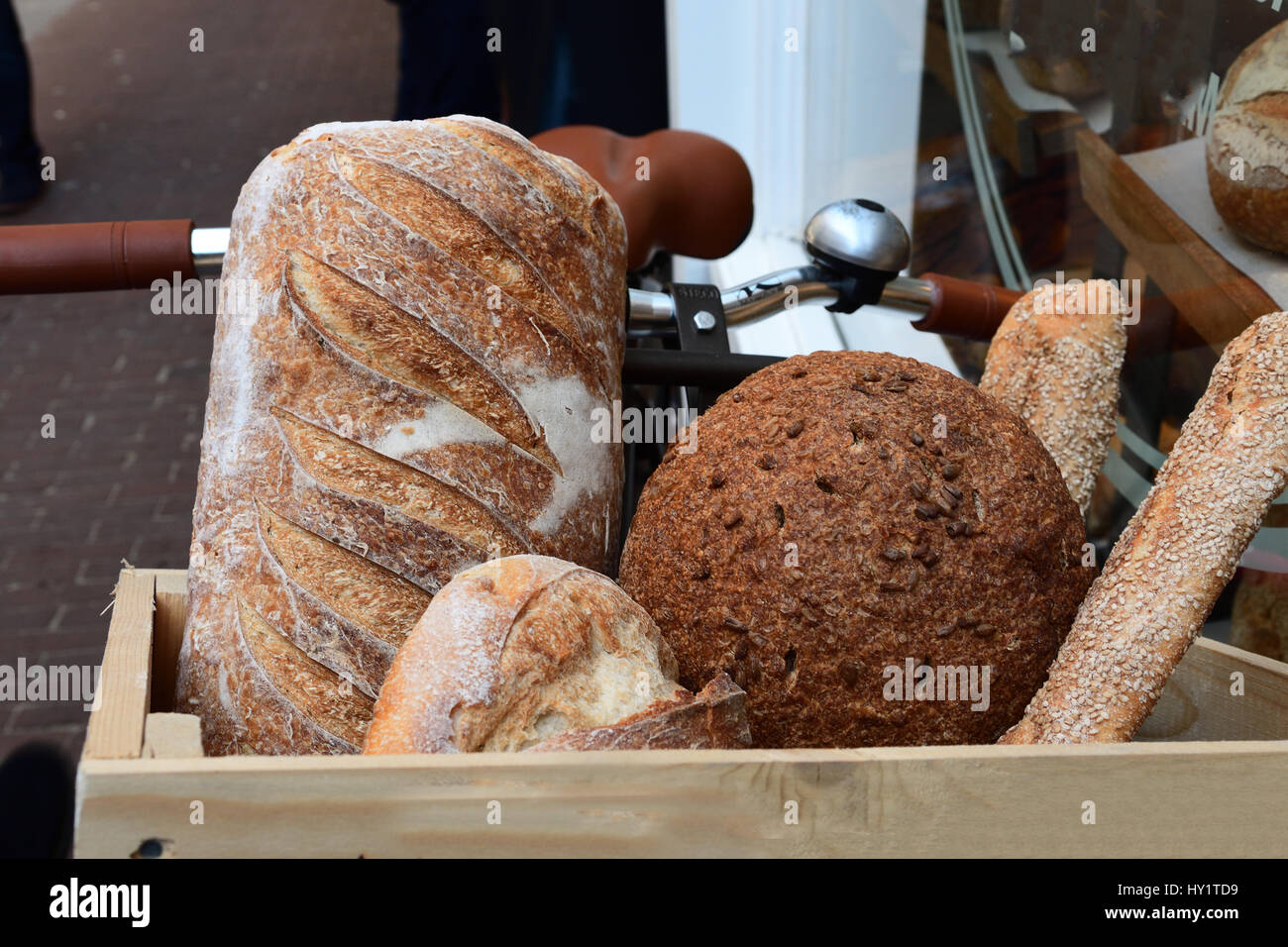 box with loaves of bread on bicycle for delivery Stock Photo