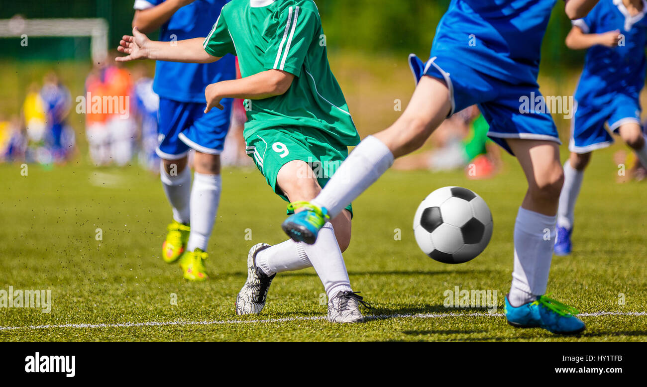 Football Player Running with the Ball on the Pitch. Footballers Kicking ...