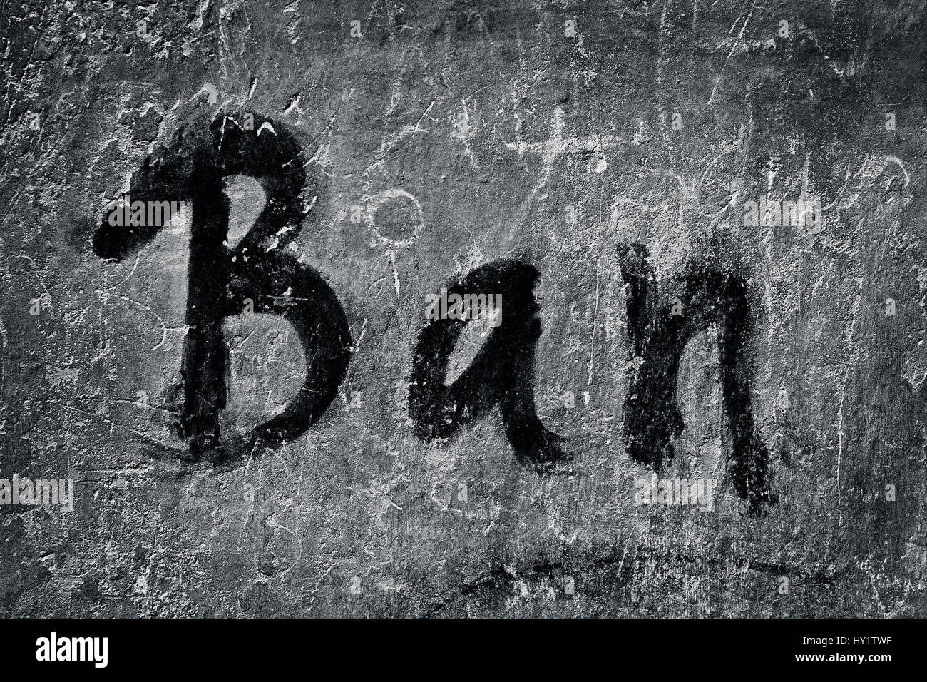 Ban written on the wall with a paint brush. Stock Photo