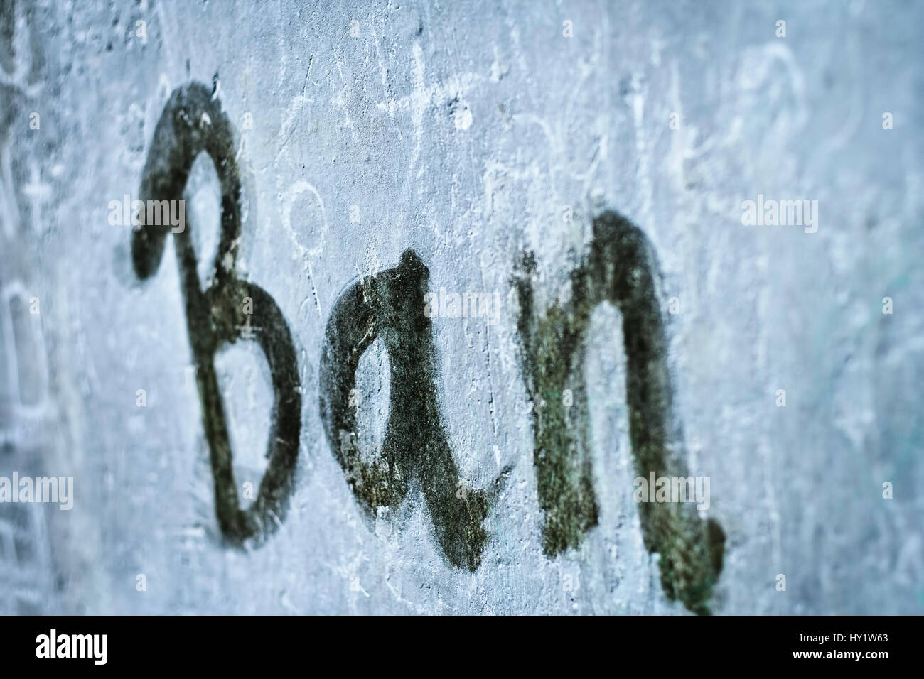 Ban written on the wall with a paint brush. Stock Photo