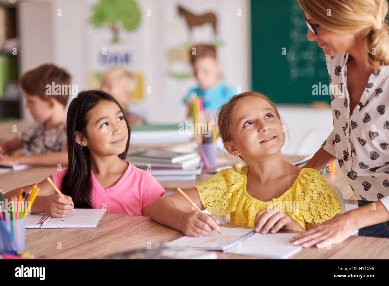 Teacher and her two pupils Stock Photo