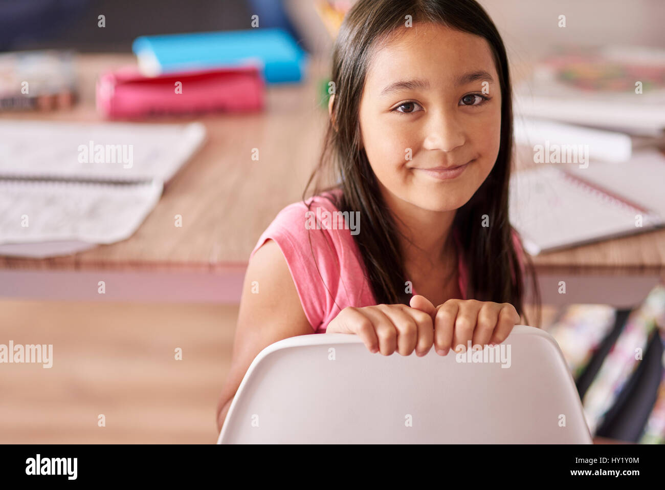 Asian ethnicity girl sitting on the chair Stock Photo