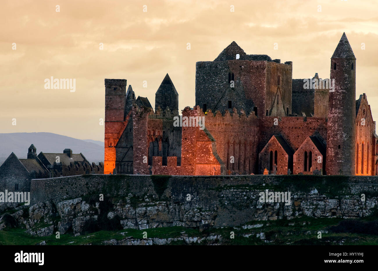 This stock photo shows the illuminated Irish castle Rock of Cashel. The image was taken on a sunny spring afternoon. Stock Photo