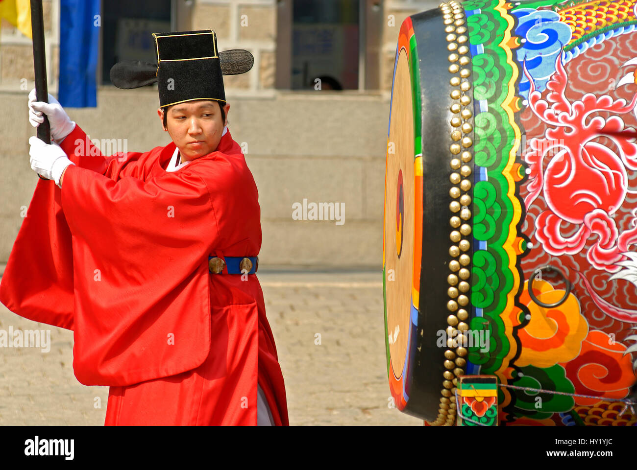 Image of a Korean Drummer in traditional costume performing during the royal guard rotation at the Gyeongbokgung Palace in Seoul, South Korea. Stock Photo