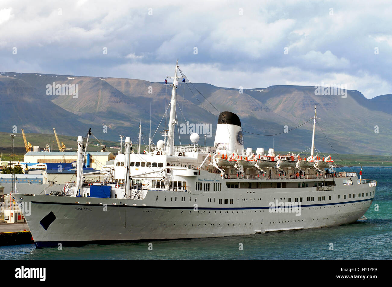 This stock photo shows the cruise ship Funchal anchored in the port of Akureyri in Iceland. The ship is cruising for Classic International Cruises. Th Stock Photo