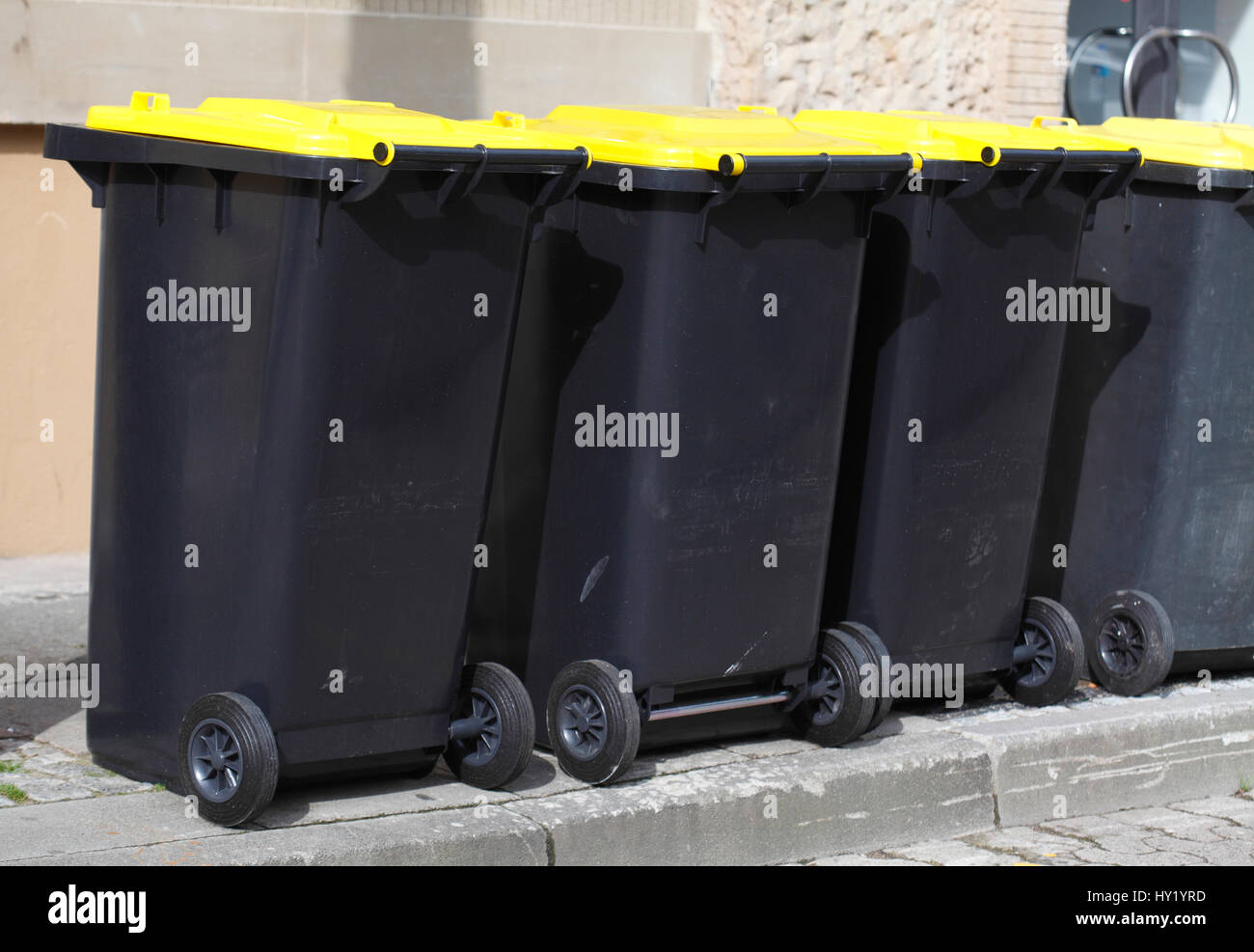 Yellow recycling bins hi-res stock photography and images - Alamy