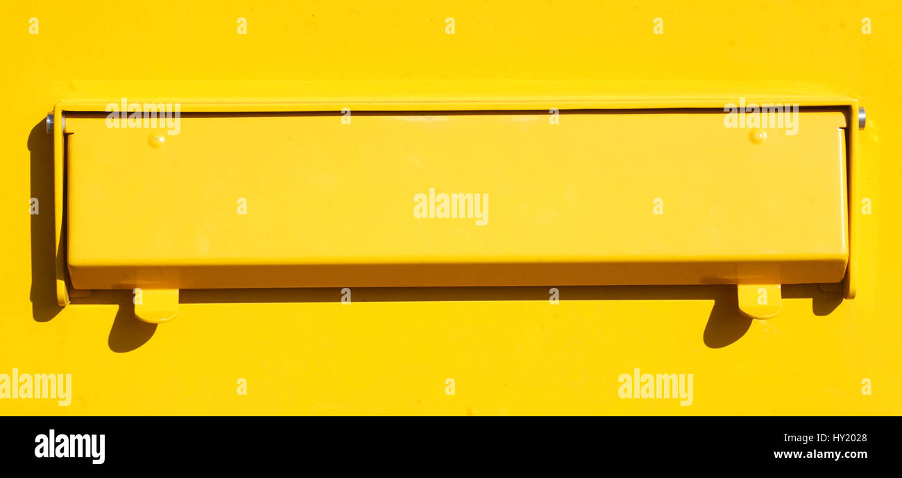Yellow Letterbox with mail slot Stock Photo Alamy