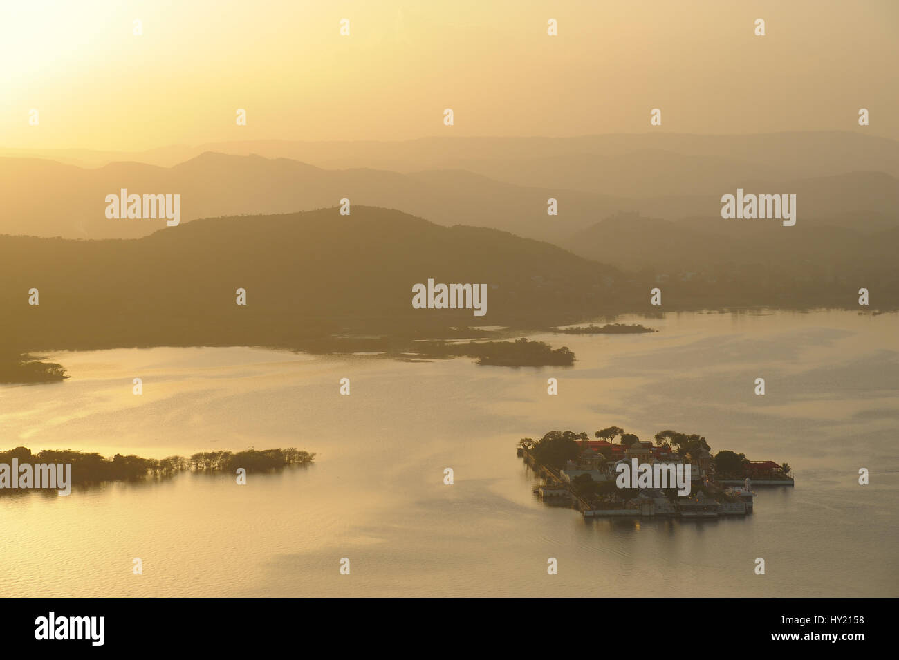 Evening view, from Deen Dayal Park, down to Lake Pichola, Lake Garden Palace and across to the Aravalli Hills Stock Photo