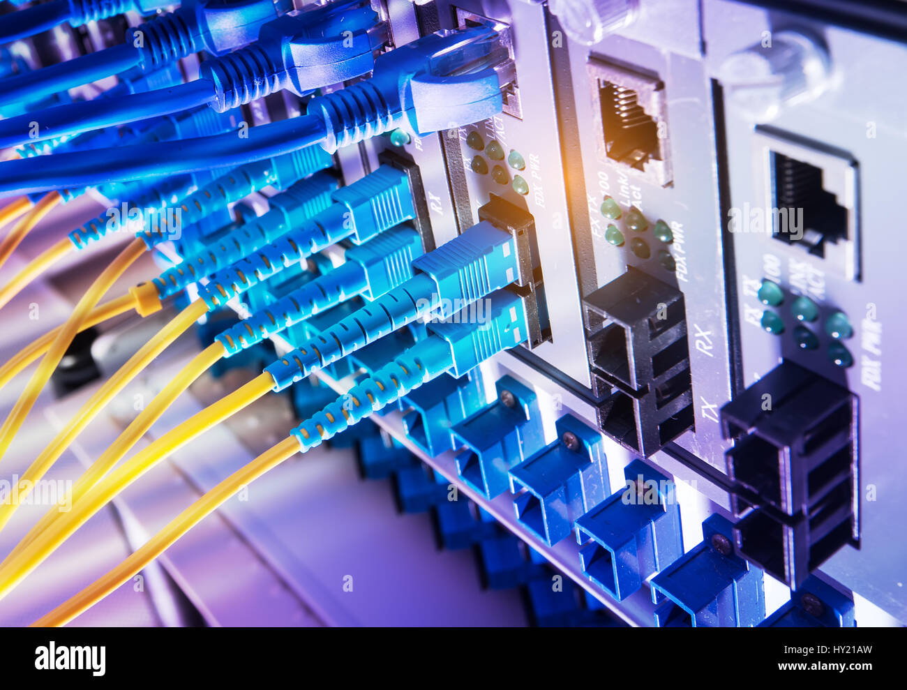 Fiber Optic cables connected to an optic ports and Network cables