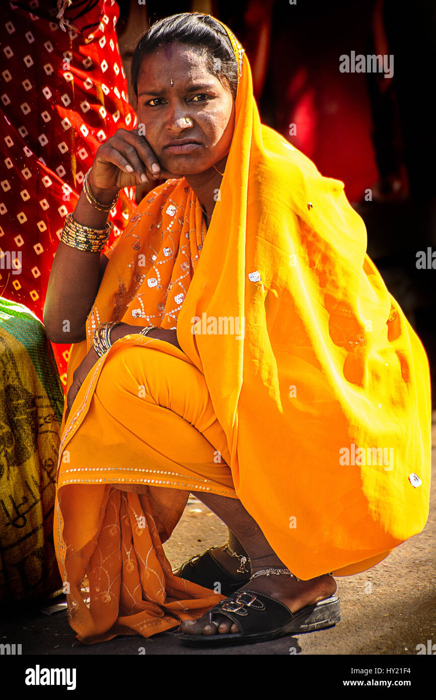 Young Indian woman in a vibrant yellow sari Stock Photo - Alamy