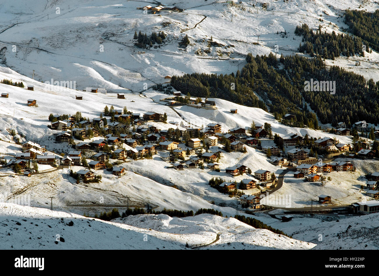 This stock photo shows the small mountain village of Arosa a ski resort in Switzerland. Arosa is surrounded by mountains and is quite a famous Swiss s Stock Photo