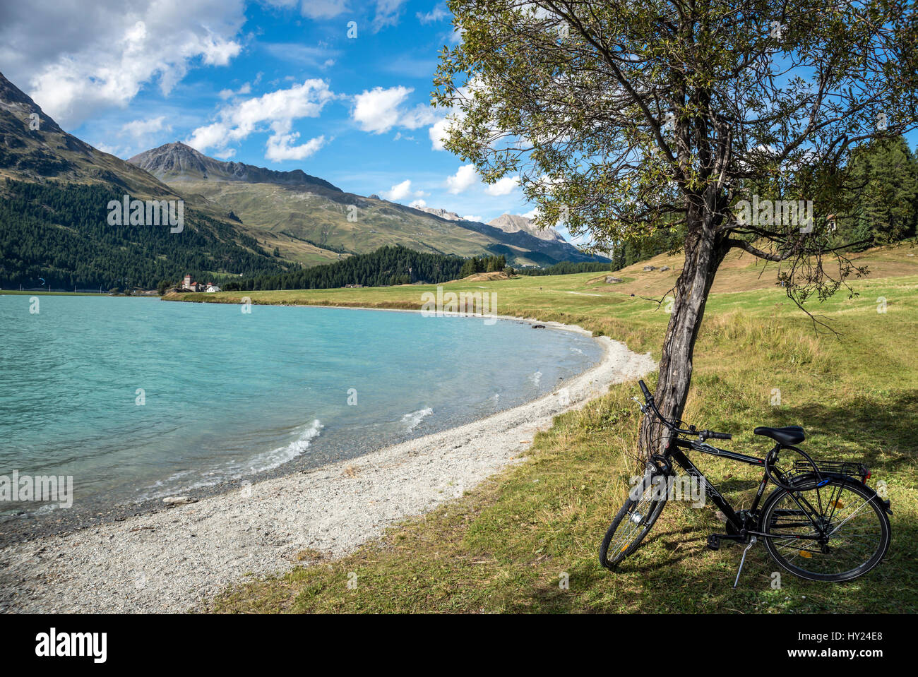 Bicycle in a Spring landscape at Lake Silvaplana, Engadine, Switzerland. | Fahrrad am Silvaplaner See im Fruehling Engadin, Schweiz Stock Photo