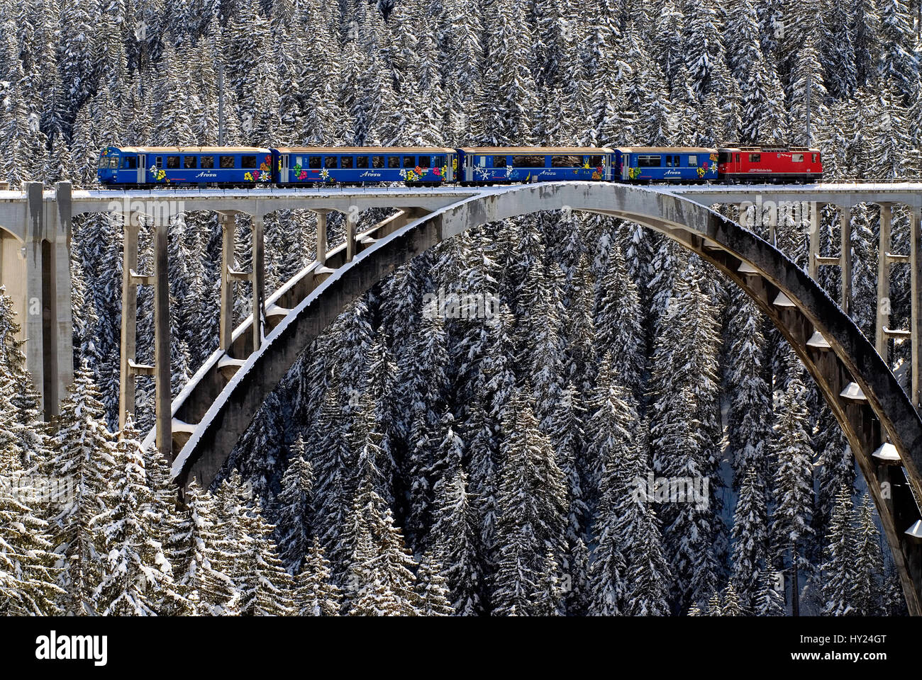 Arosa train on the Langwies Bridge in a beautiful mountain landscape near Arosa a ski resort in Switzerland. Stock Photo