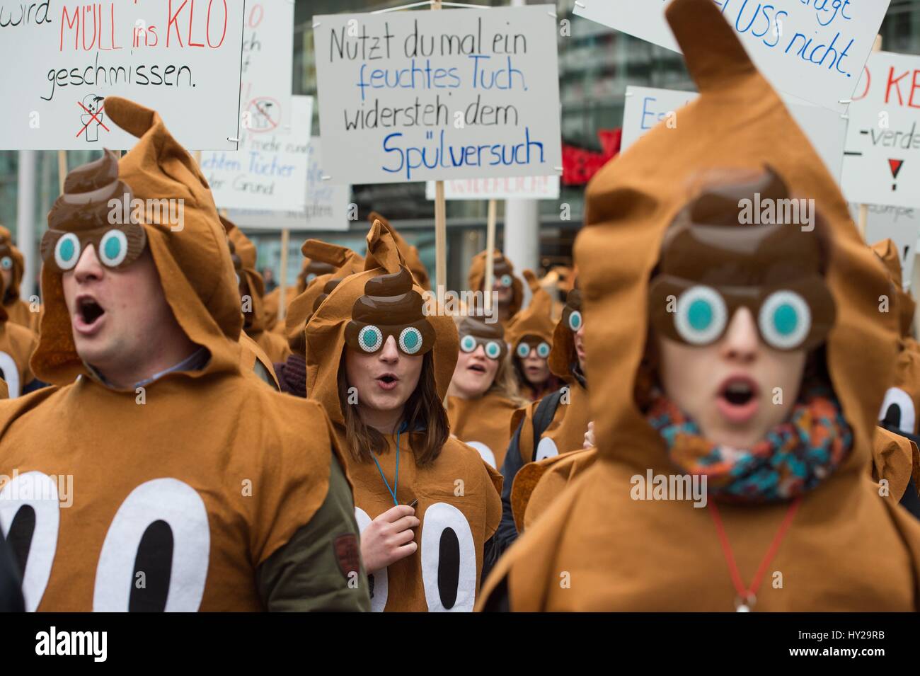 Dresden, Germany. 21st Mar, 2017. Protesters dressed up as piles of human excrement taking part in a demonstration in Dresden, Germany, 21 March 2017. The demonstration was called on the occasion of World Water Day (22 March). The participants wanted to draw attention to the problem of the large amount of rubbish in sewage water, which not only raises processing costs but also damages the environment. Photo: Sebastian Kahnert/dpa-Zentralbild/dpa/Alamy Live News Stock Photo