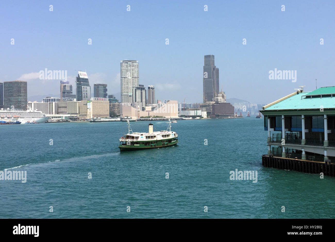 The legendary Star Ferry at the new ferry terminal, with the skyline of