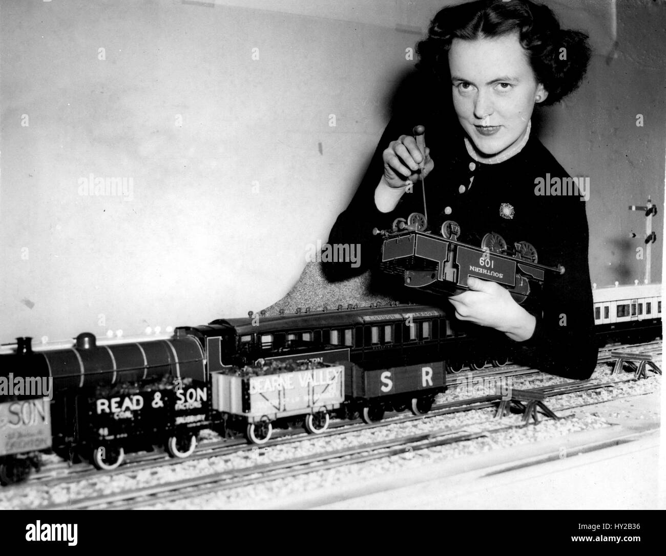 Nov. 11, 1955 - 11-4-55 Preparations for Model Railway Exhibition Ã¢â‚¬â€œ The Model Railway Exhibition opens at the Central Hall, Westminster, tomorrow. Keystone Photo Shows: Mrs. Isabel Robert, of Holborn, who makes trains as a hobby, and who will be the only woman exhibitor at the exhibition seen helping to get a model railway together at the Central Hall today. (Credit Image: © Keystone Press Agency/Keystone USA via ZUMAPRESS.com) Stock Photo