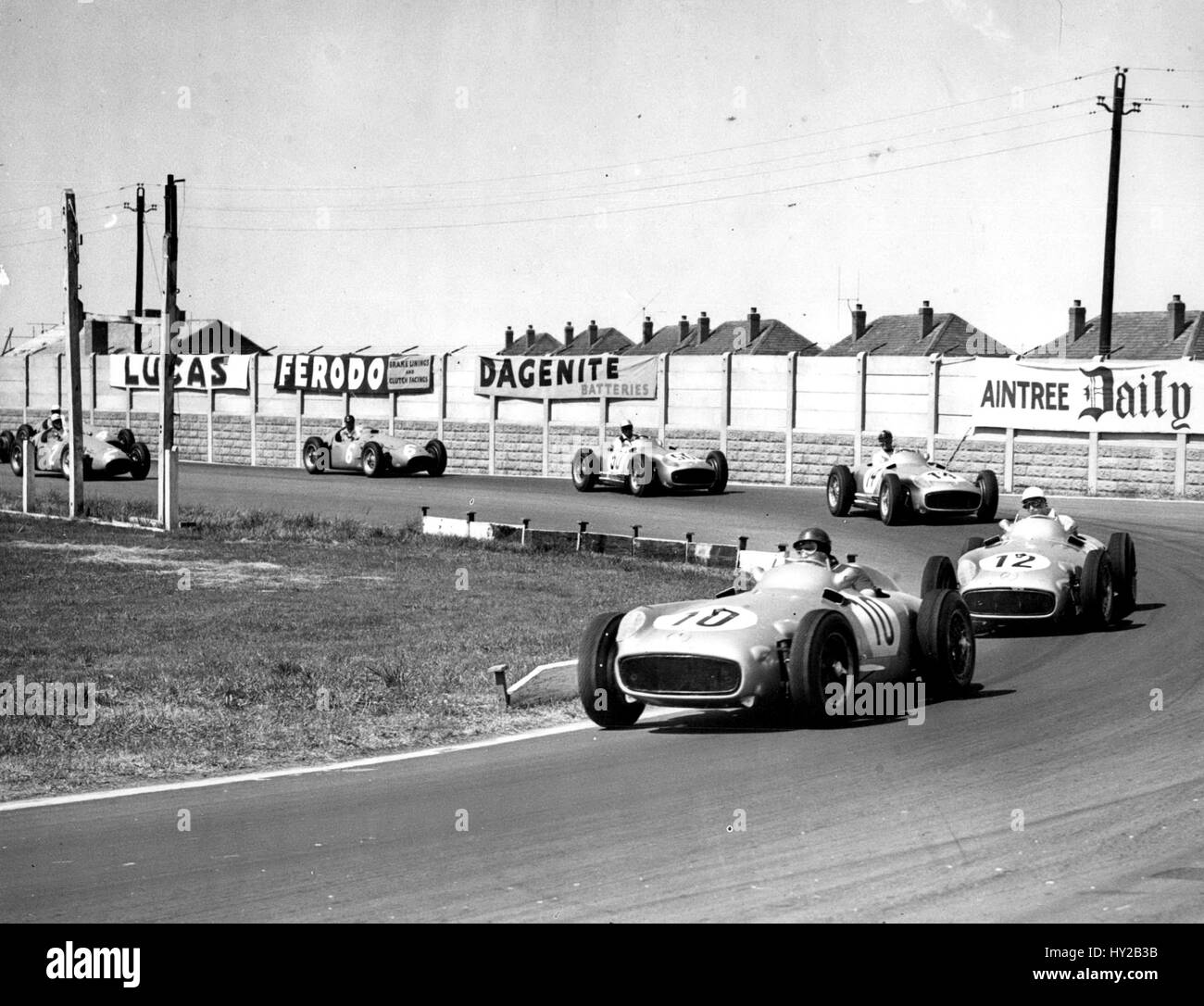 Jul. 17, 1955 - Stirling Moss Wins British Grand Prix At Aintree - Becomes First Briton To Win Event: Stirling Moss won the British Grand Prix before a record crowd of 125,000 over the Aintree, Liverpool, motor circuit yesterday, driving a Mercedes car at a speed of 86.47 m.p.h. for the 270 miles and thus became the first Briton to win the British Grand Prix. The first three men drove Mercedes cars-Stirling Moss, Juan Fangio, second and Karl Kling third. Photo shows Juan Fangio leading Stirling Moss at Anchor Crossing during the race. (Credit Image: © Keystone Press Agency/Keystone USA via ZUM Stock Photo