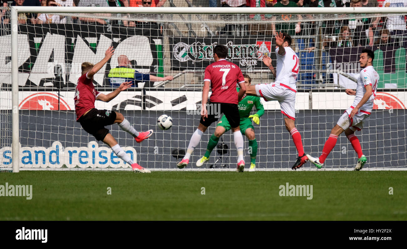 Hannover's Niclas Fuellkrug (l) goes to score 1:0 during the German