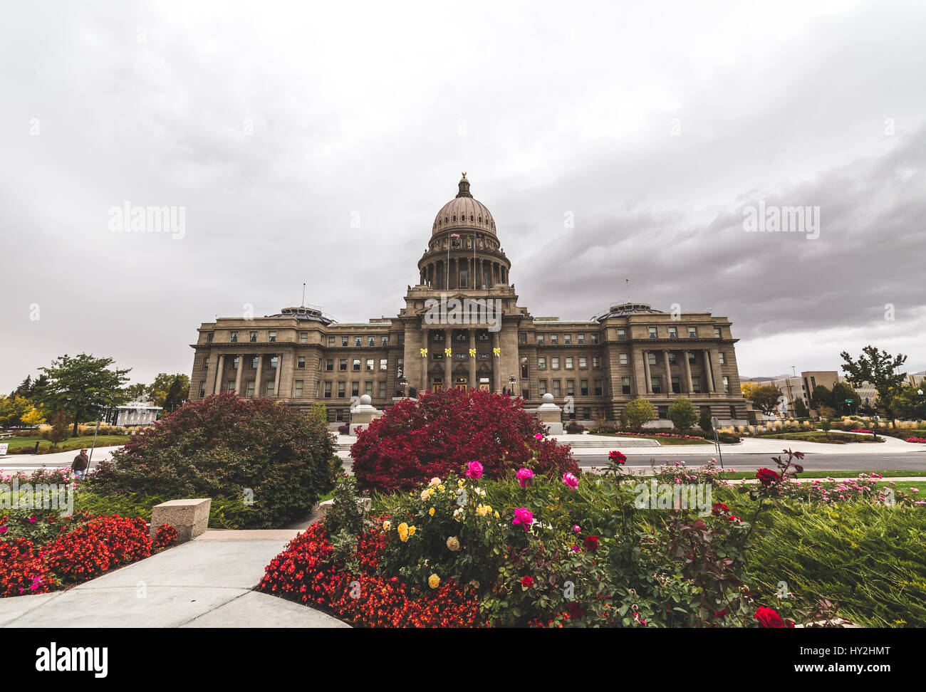 Boise State Capitol Building with bright flowers and cloudy sky. Stock Photo