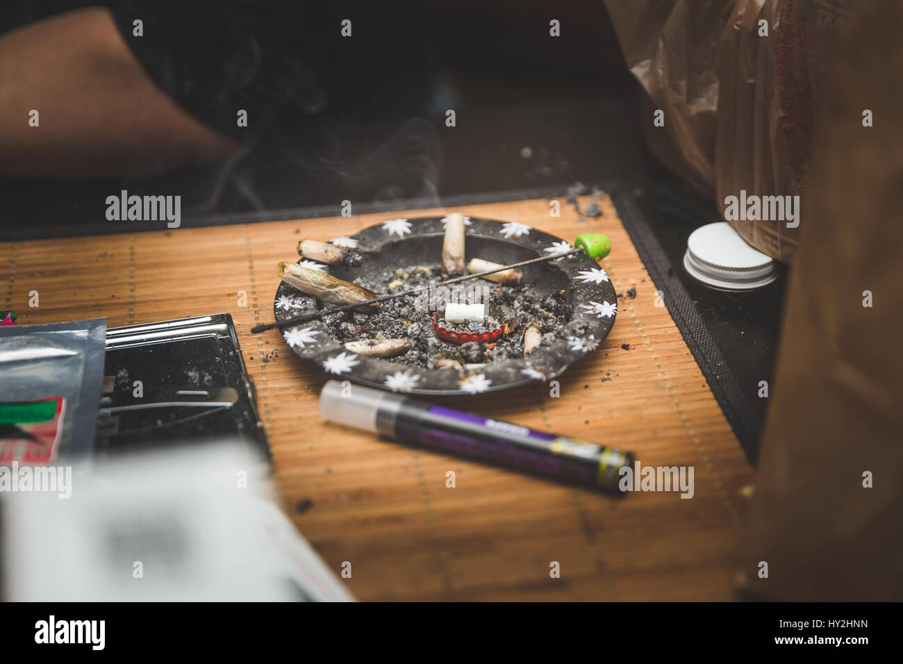 Ash tray with cigarettes, joints, or spliffs in it. Stock Photo