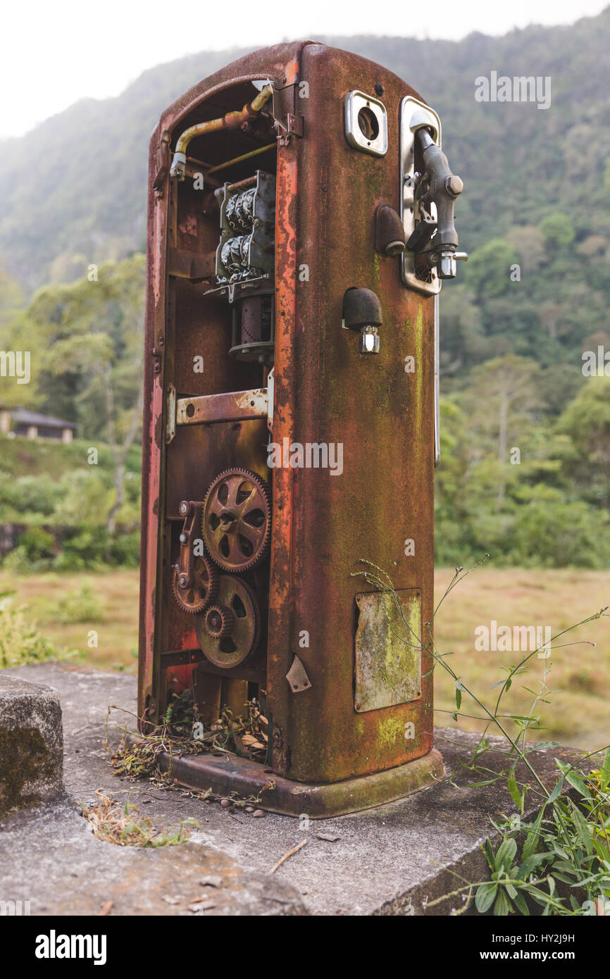 Heavily rusted, antique gas pump in the remote jungle near Lake Atitlan